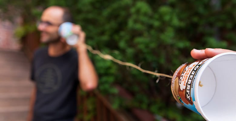 Person using pints as a telephone